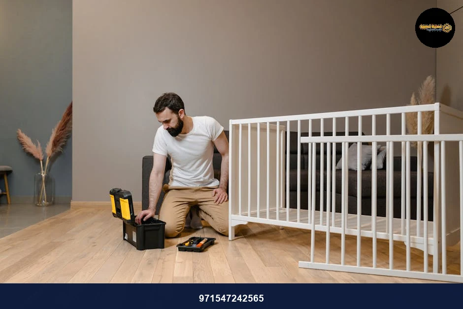 A man assembling a white crib indoors with tools, focusing on DIY and home care.