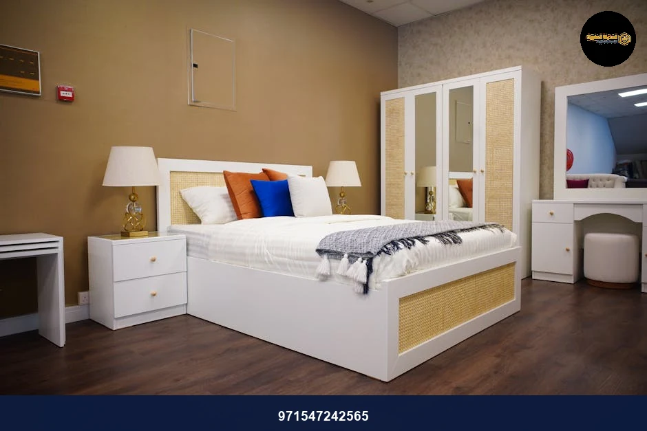 Chic modern bedroom featuring white furniture and warm lighting for a cozy ambiance.