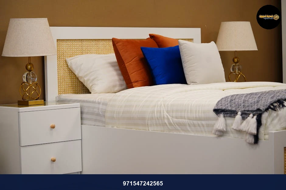 Cozy modern bedroom with elegant decor and warm lighting featuring neutral tones and stylish furniture.