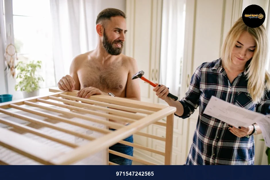 Expectant parents assembling a baby crib, preparing for parenthood with teamwork.
