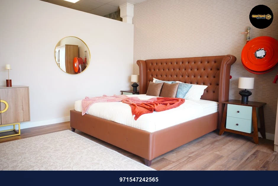 Sophisticated modern bedroom featuring luxury furniture and warm tones in Ajman, UAE.