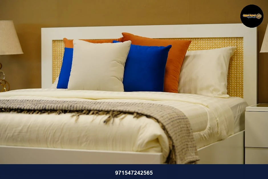Modern bedroom featuring elegant decor and colorful cushions for a cozy retreat.