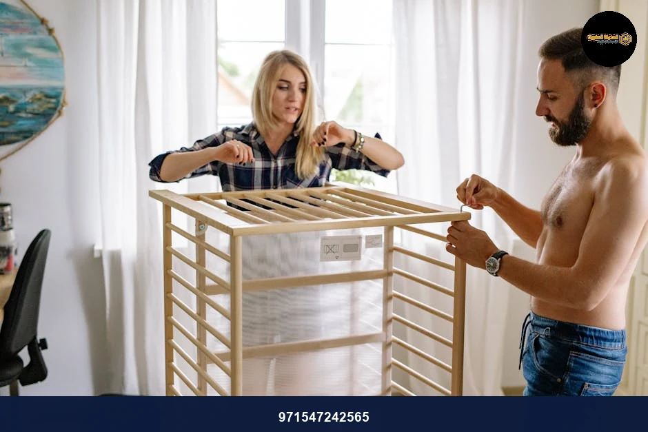 Expectant couple assembling a crib in a modern bedroom, preparing for a new family member.
