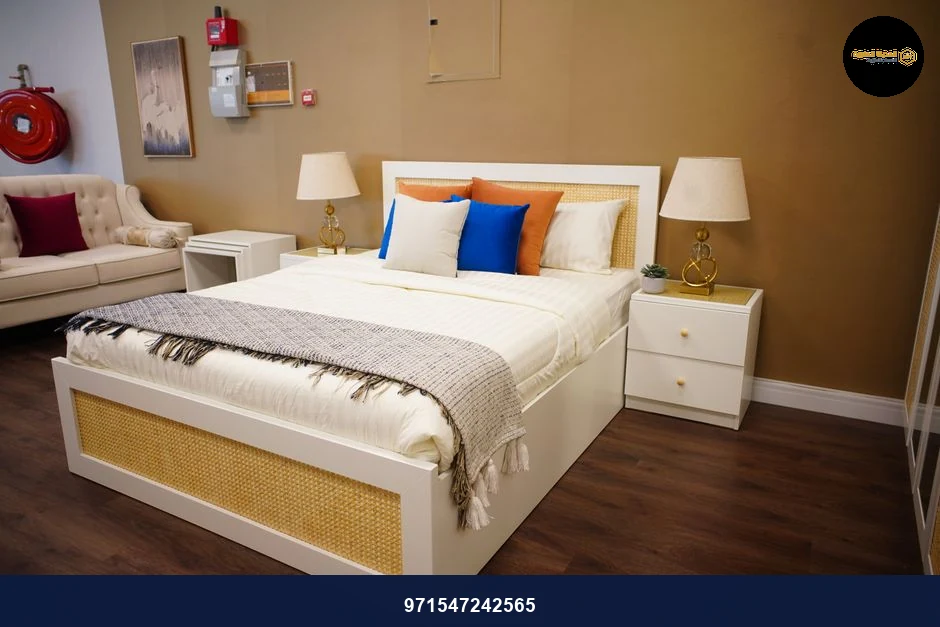 Stylish bedroom featuring a modern bed, cozy sofa, and elegant decor in a warm, minimalistic setting.