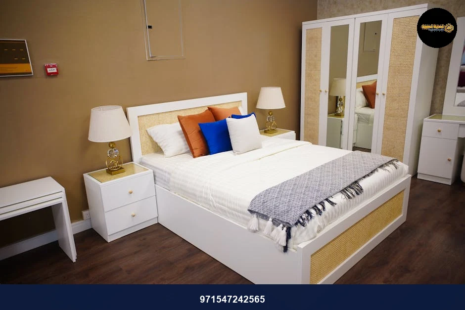 Modern bedroom with elegant decor, featuring a cozy bed and stylish furniture in Ajman, UAE.