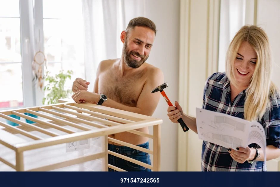 A happy couple assembles a baby crib with laughter and teamwork indoors. A happy couple assembles a baby crib with laughter and teamwork indoors.
