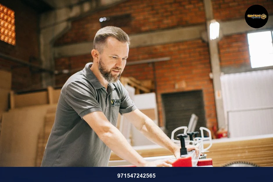 Carpenter using a table saw in a workshop, focusing on precise cuts on wood.