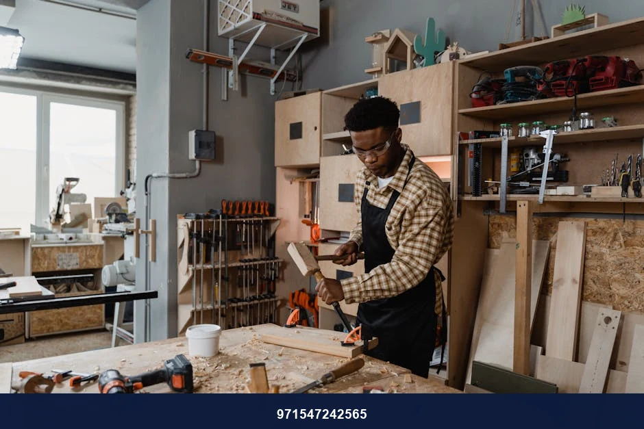 A professional woodworker carving timber in a well-equipped workshop, showcasing craftsmanship.