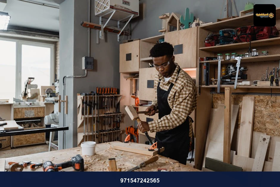 A professional woodworker carving timber in a well-equipped workshop, showcasing craftsmanship. A professional woodworker carving timber in a well-equipped workshop, showcasing craftsmanship.
