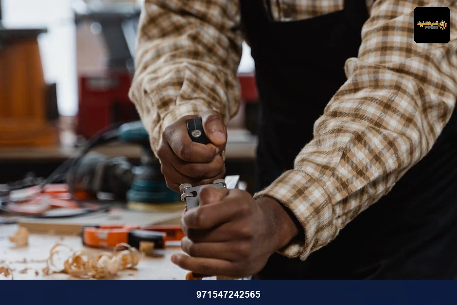 A craftsman skillfully using a hand plane on wood in a woodworking workshop. A craftsman skillfully using a hand plane on wood in a woodworking workshop.