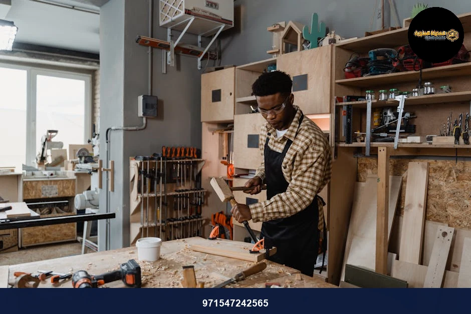 A professional woodworker carving timber in a well-equipped workshop, showcasing craftsmanship.