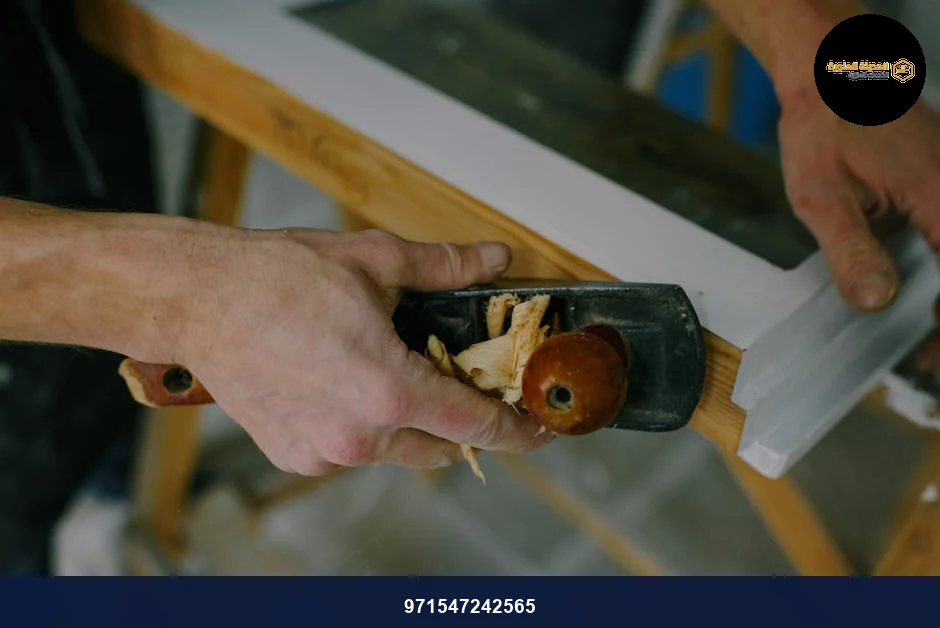 From above of crop anonymous joiner cutting wooden frame with manual jack plane at work From above of crop anonymous joiner cutting wooden frame with manual jack plane at work