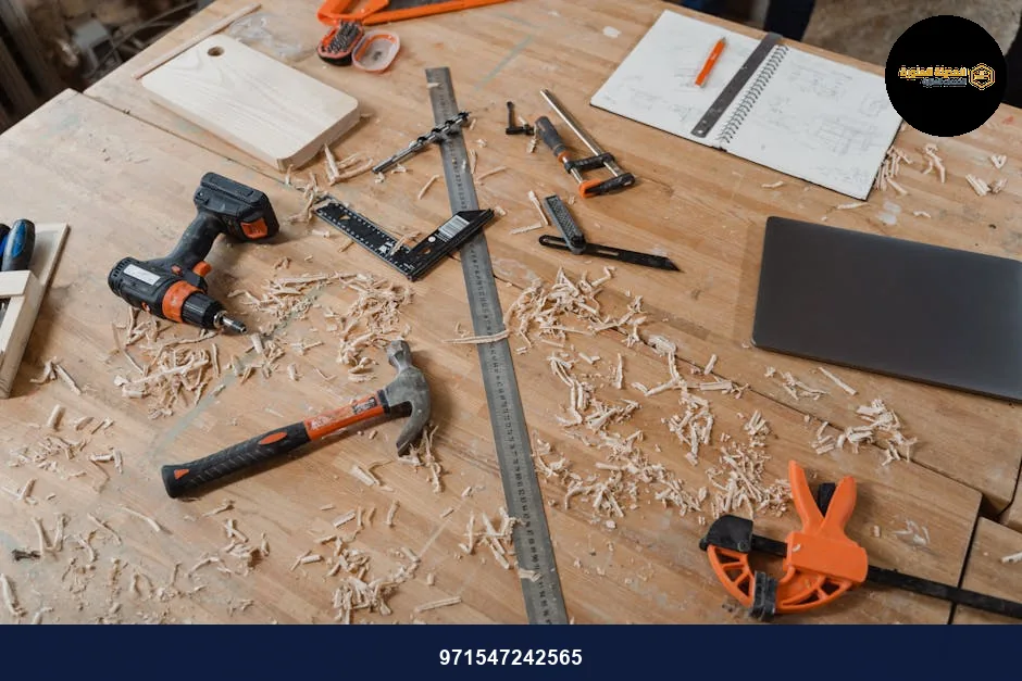 A workbench with various woodworking tools alongside sketches and wood shavings, indicating an active project. A workbench with various woodworking tools alongside sketches and wood shavings, indicating an active project.