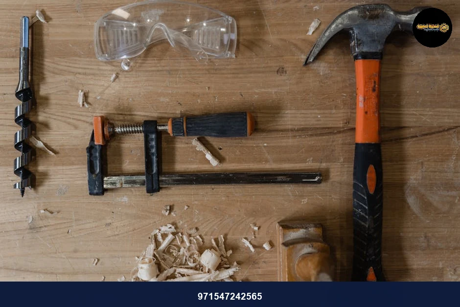 Flat lay of carpentry tools and wood shavings on a workbench. Ideal for DIY themes.