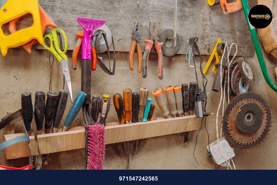 Organized hand tools on wall in a workshop. Essential carpentry equipment neatly displayed.