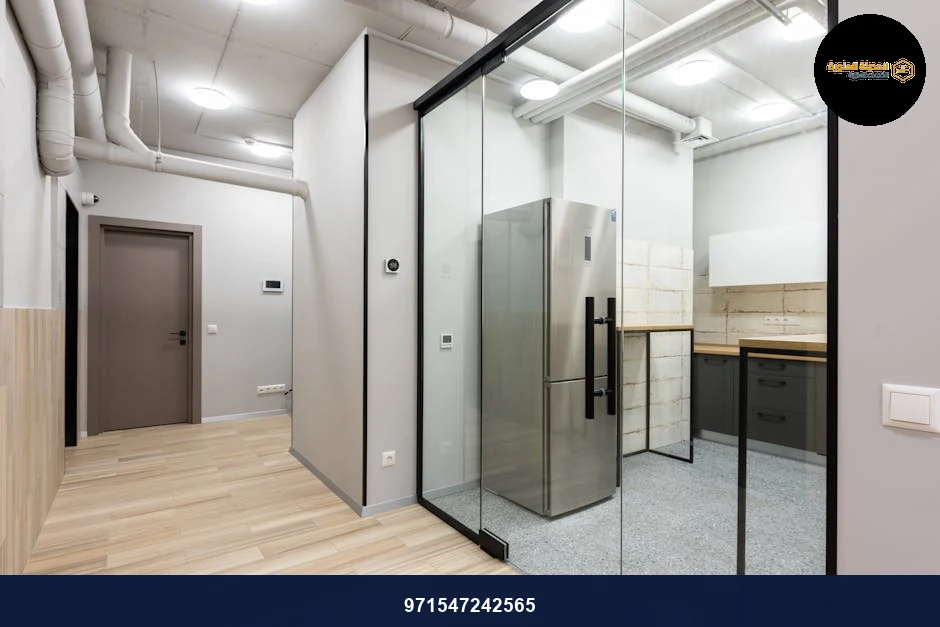 Interior of spacious hallway and kitchen with counters and appliances in contemporary workplace. Interior of spacious hallway and kitchen with counters and appliances in contemporary workplace.