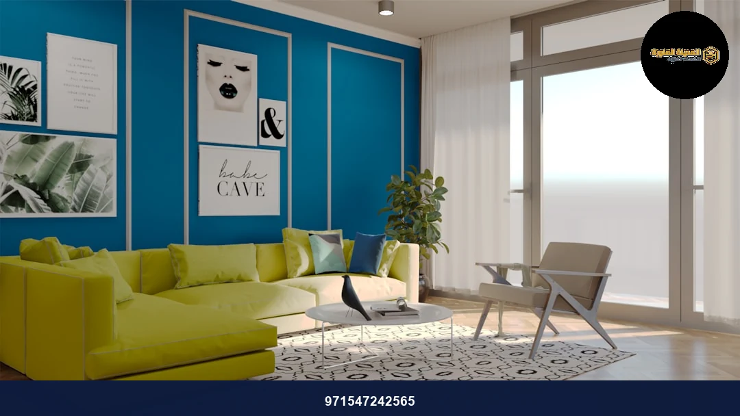 a living room with blue walls and a green couch