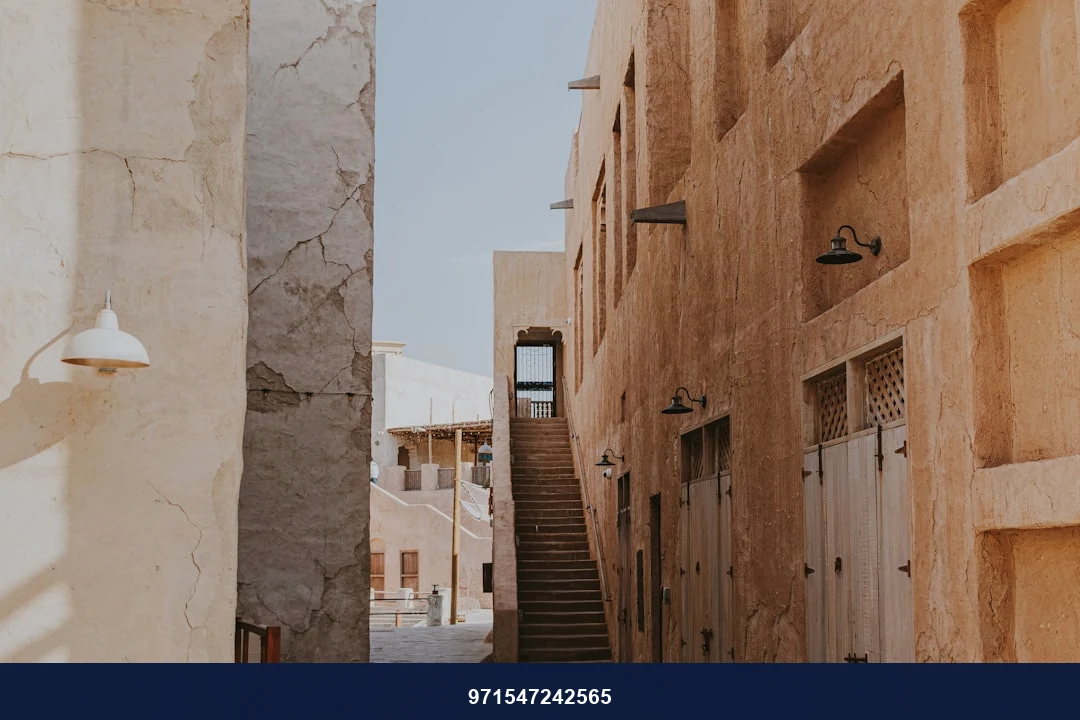A narrow alley way with steps leading up to a building