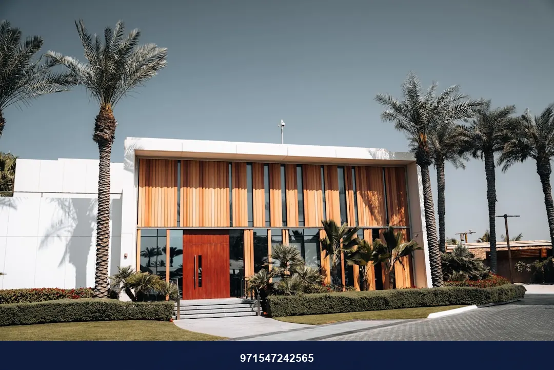 A large building with palm trees in front of it